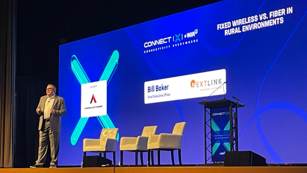speaker Bill Baker on stage at Connect(X)